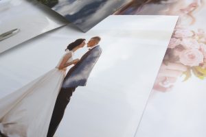 Pile of wedding photos printed on kodak endura professional metallic photo paper