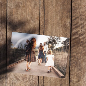 Fine art print of family on canson rag photographique smooth laying on a wooden tabletop