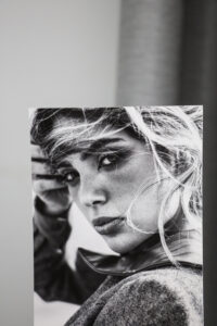 Black and white print on smooth matt rag photo fine art paper of a blond model