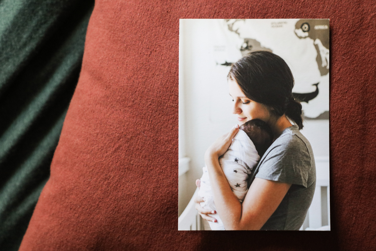 Photographic fine art smooth rag photographique print on a cushion of a woman holding a baby