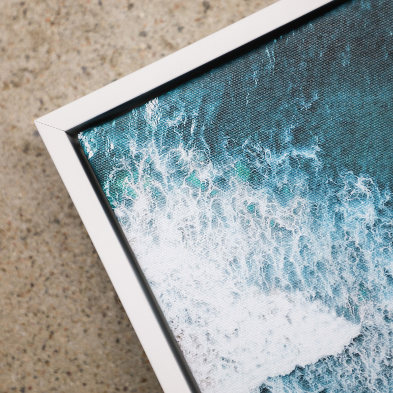 Arial shot of beach on canvas with a white float frame