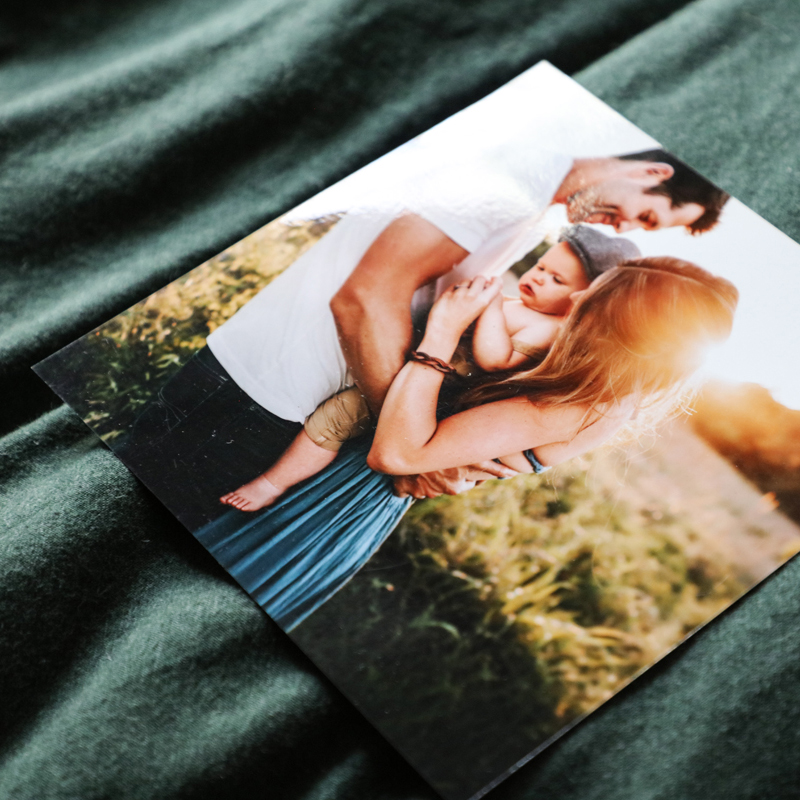 Gloss photo print of mum, dad and child on soft green fabric