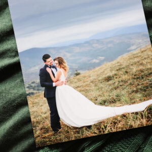 Lustre photo print of bride and groom on soft green fabric