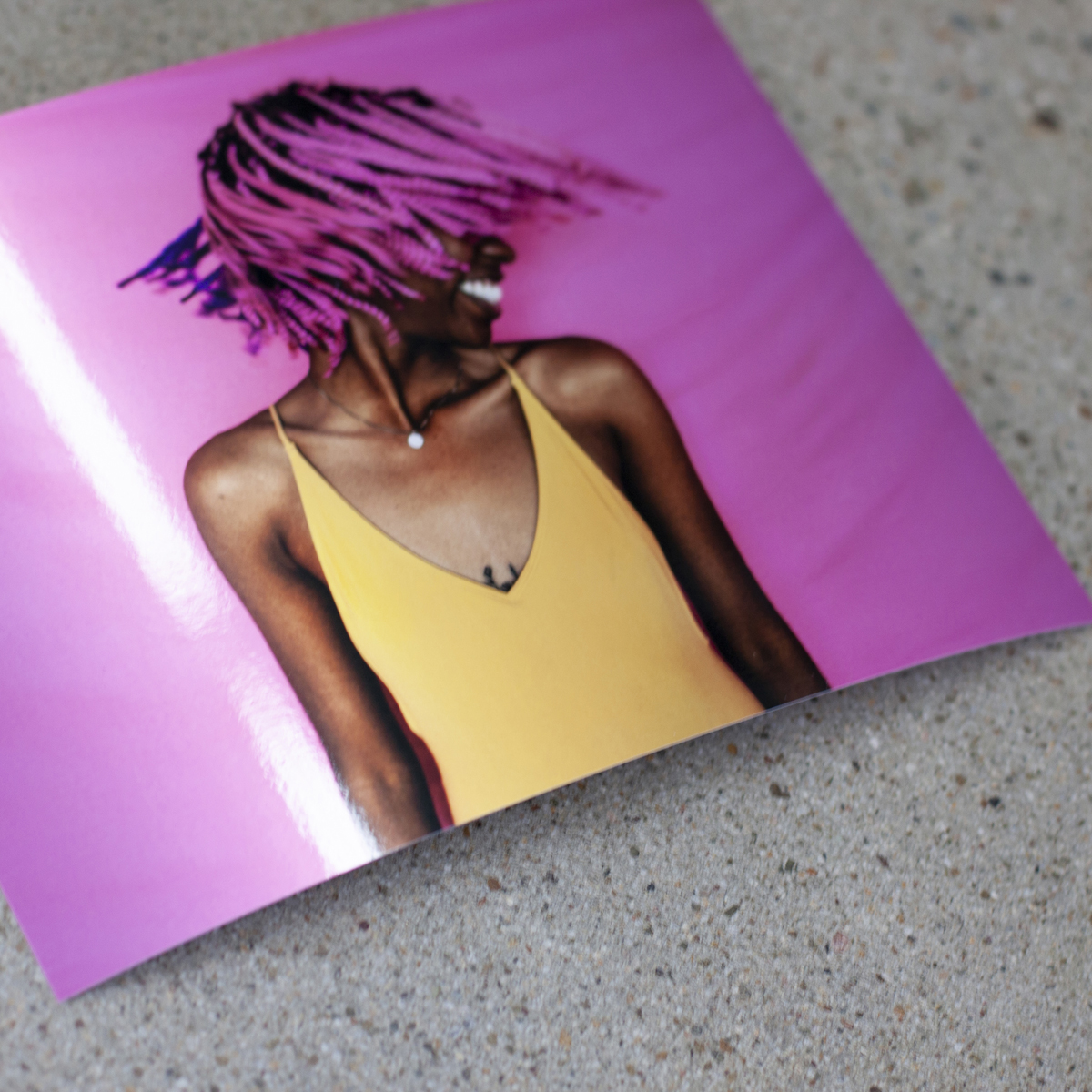 Image printed on metallic photo paper of woman with hot pink hair